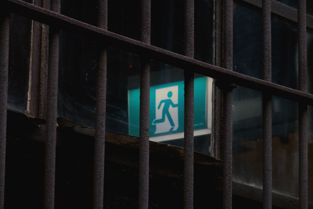 a green and white sign on the side of a building