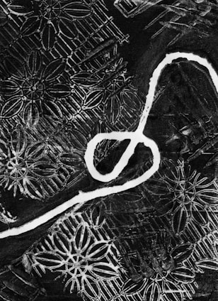 a black and white photo of a pair of scissors
