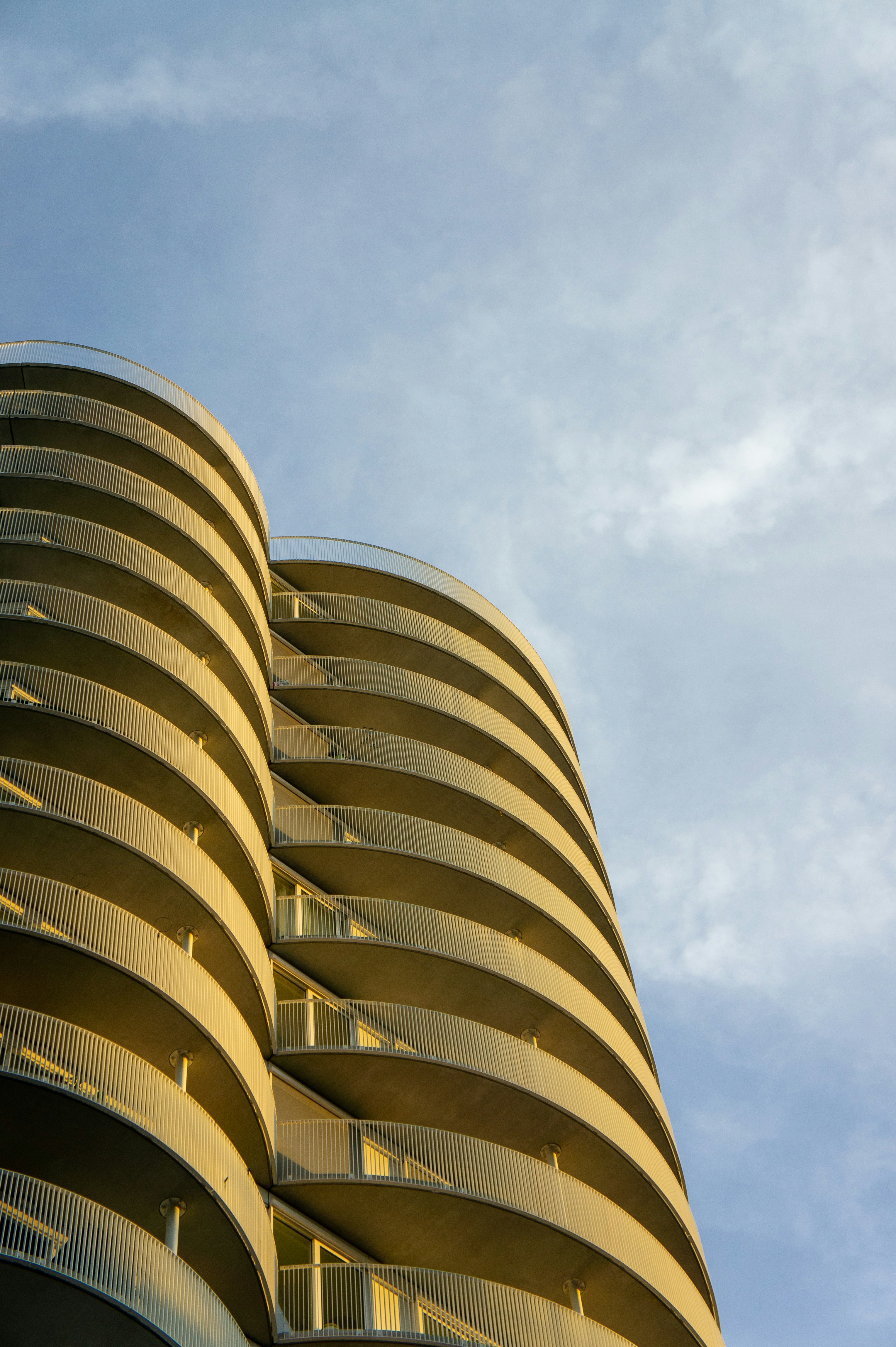 a very tall building with a lot of balconies on it