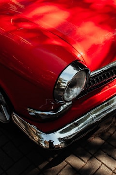 Before and after shots of a restored classic car's finish.