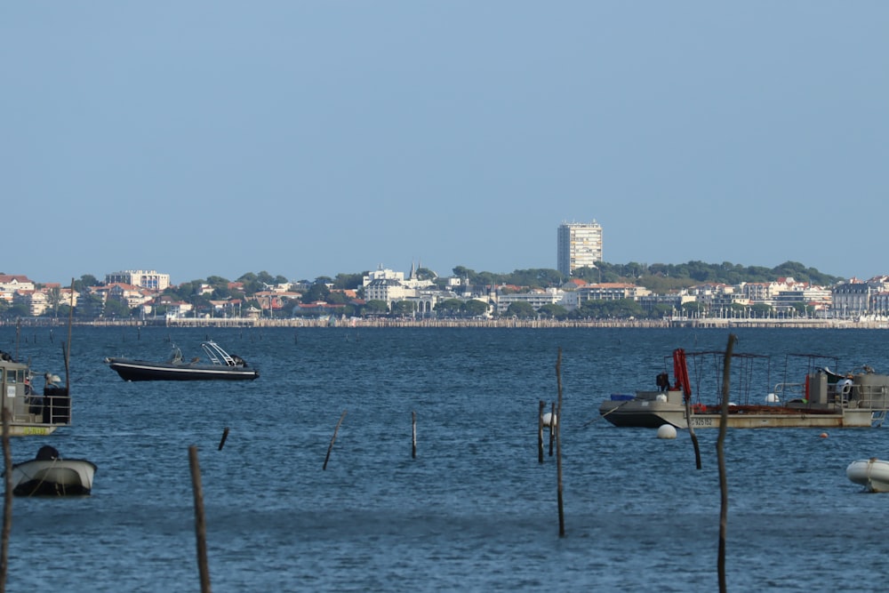 a group of boats floating on top of a body of water