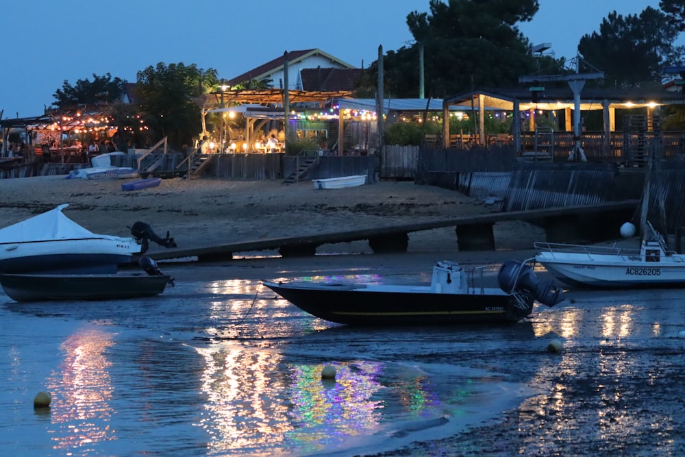 a couple of boats that are sitting in the water