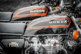 a close up of a motorcycle parked in a parking lot