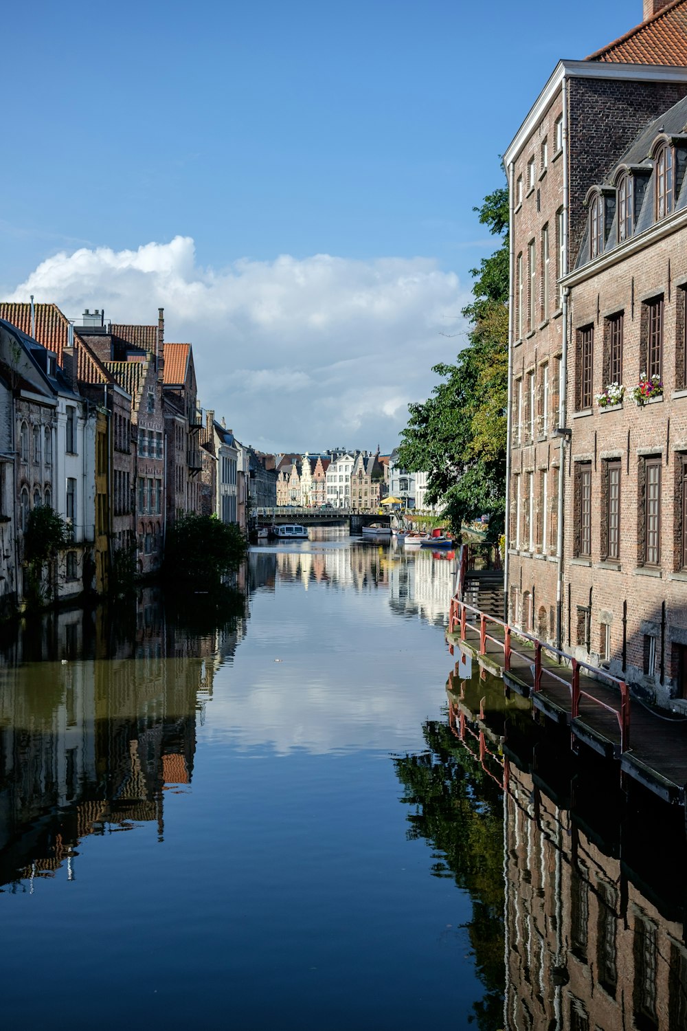 a river running through a city next to tall buildings