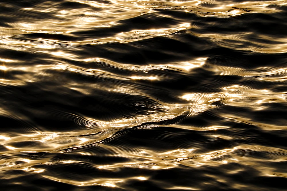 a close up of a body of water with waves