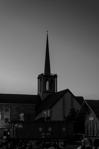 An old black-and-white photograph showing the church's original congregation gathered outside.