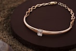 A luxurious gold bracelet featuring a modern style.