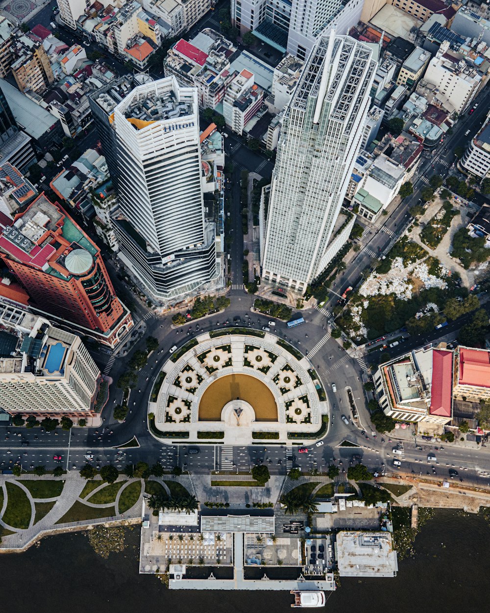 an aerial view of a city with tall buildings