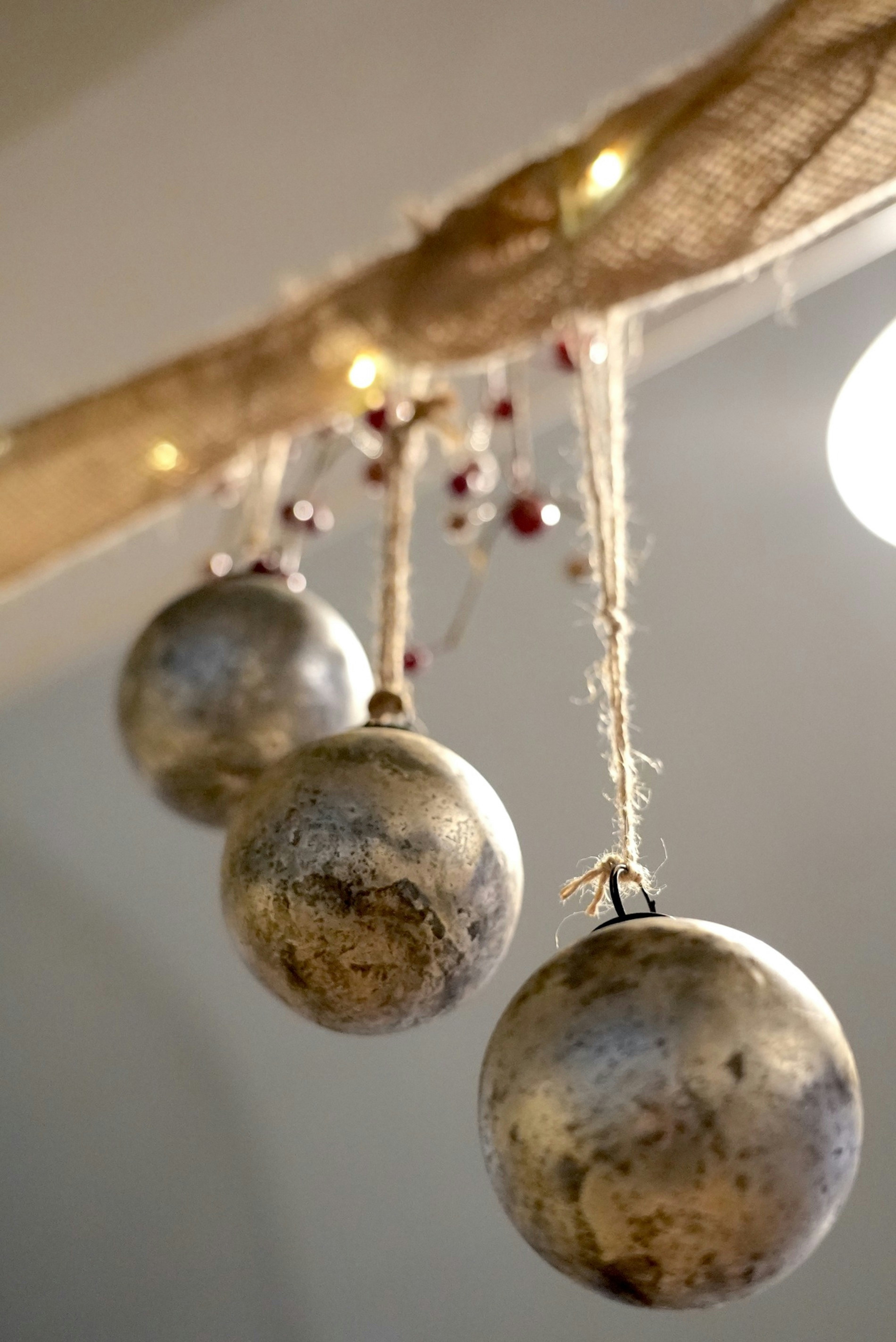 three ornaments hanging from a ceiling in a room