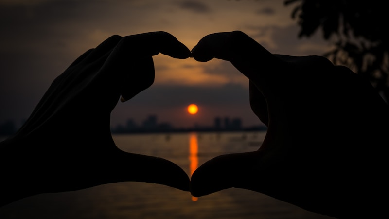 Sunset heart hands