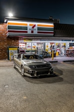 Delivery van parked outside a 7-Eleven store at sunset