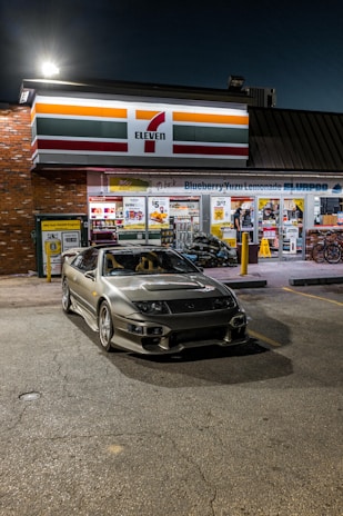 Delivery van parked outside a 7-Eleven store at sunset