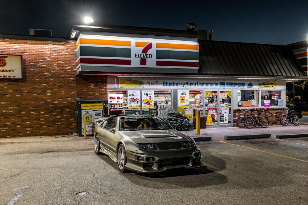 a car parked in front of a gas station