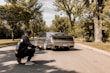A professional photographer taking car photos outdoors