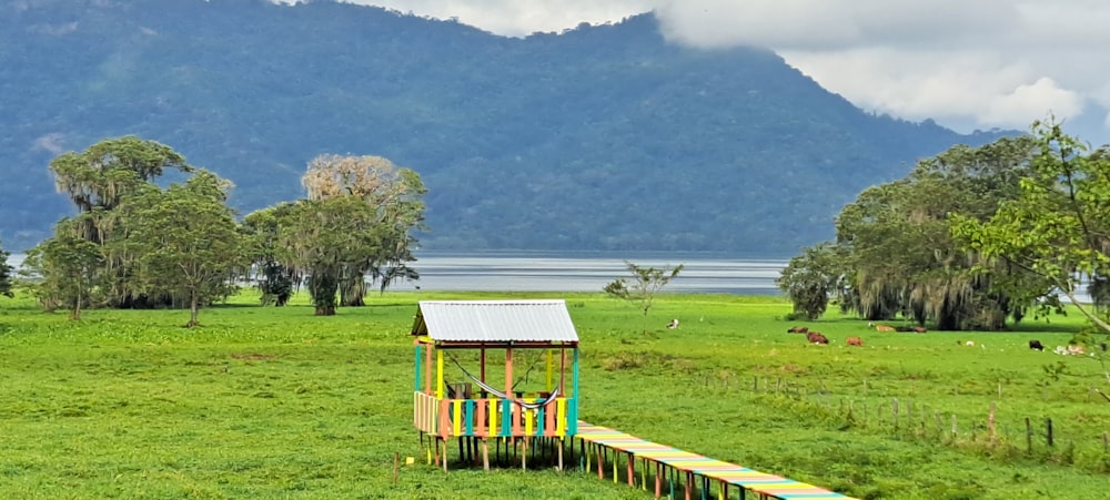 there is a small structure in the middle of a field