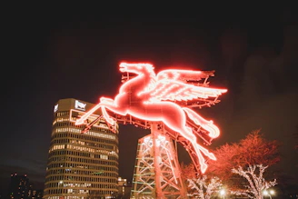A neon green horse head silhouette glowing against a dark cyberpunk cityscape at night.