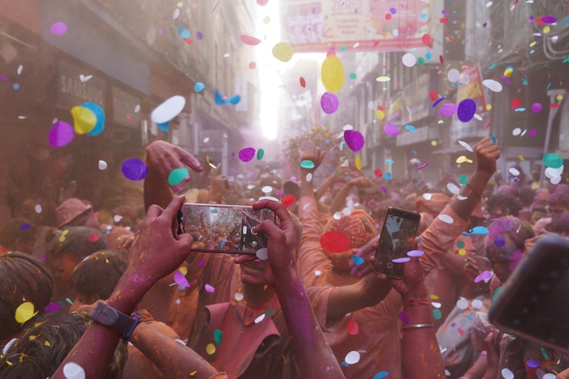 A vibrant photo capturing the joyful atmosphere of a recent local festival, with people dancing and colorful decorations.