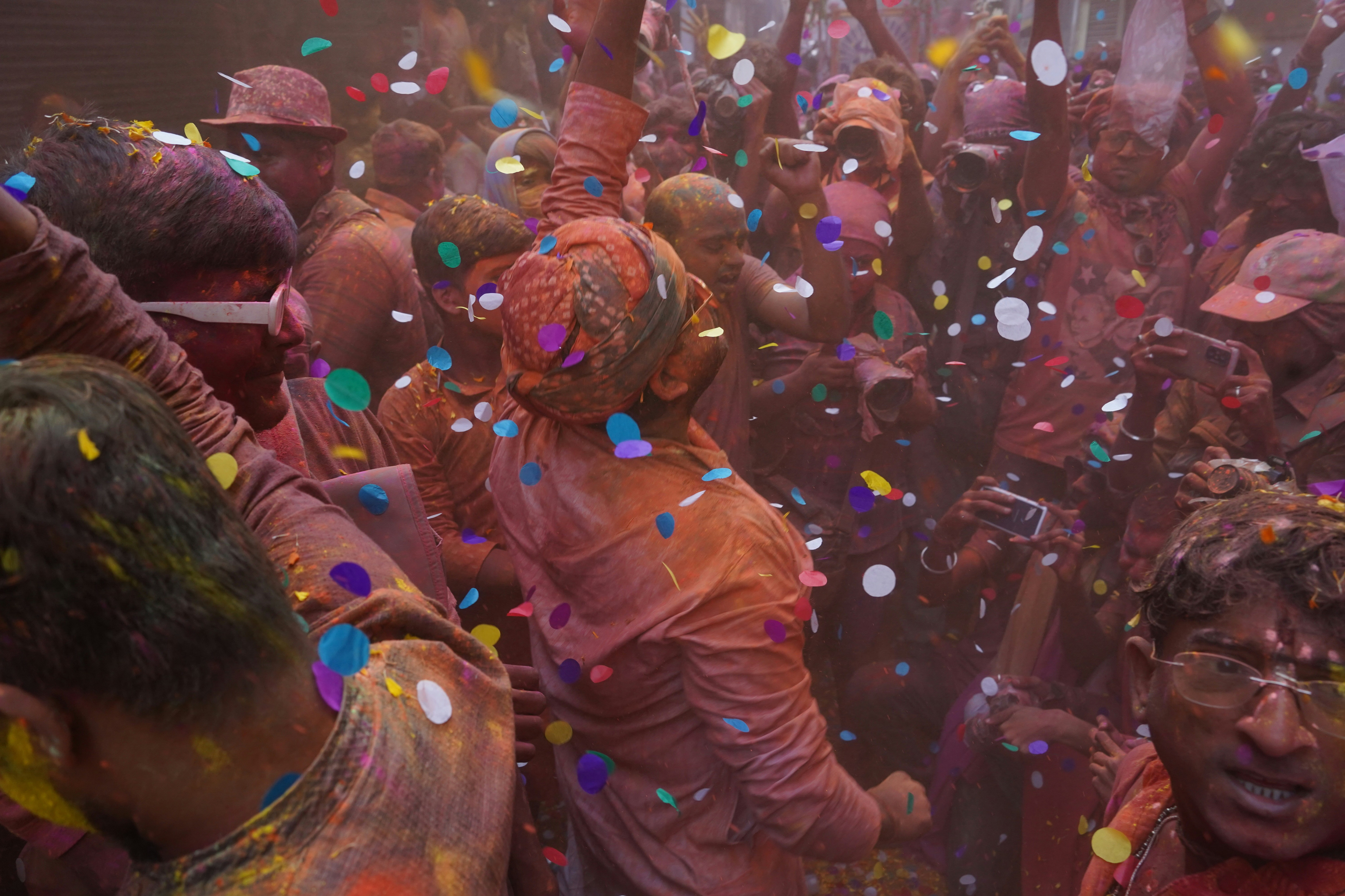 a group of people celebrating with confetti and confetti