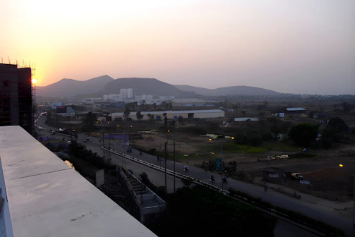 Evening view capturing sunlight fading over expansive development land ready for future projects.