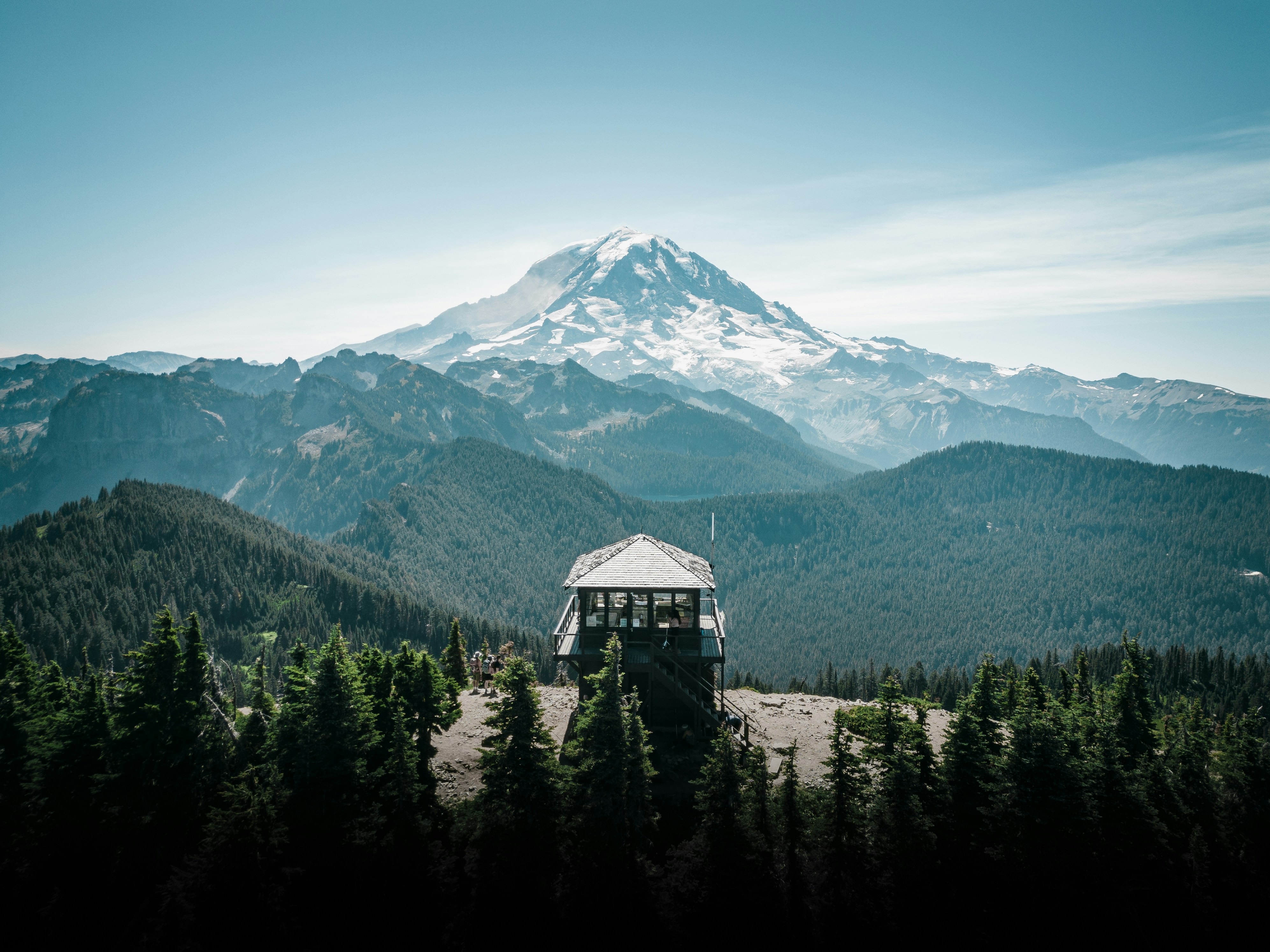 A view of a mountain with a tent in the foreground photo – Free Drone ...