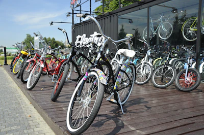 A vibrant display of various bicycles lined up outside the Warsaw bike shop.