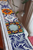 Detail of ceramic skirting tiles arranged neatly to highlight textures and colors.