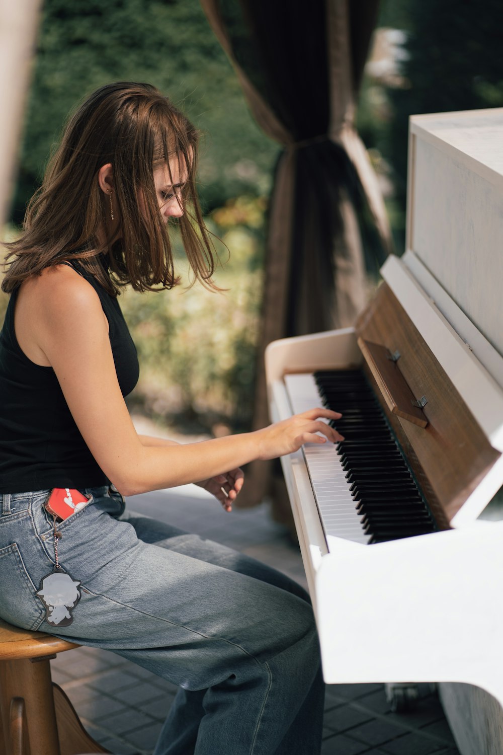 a woman sitting at a piano playing the piano