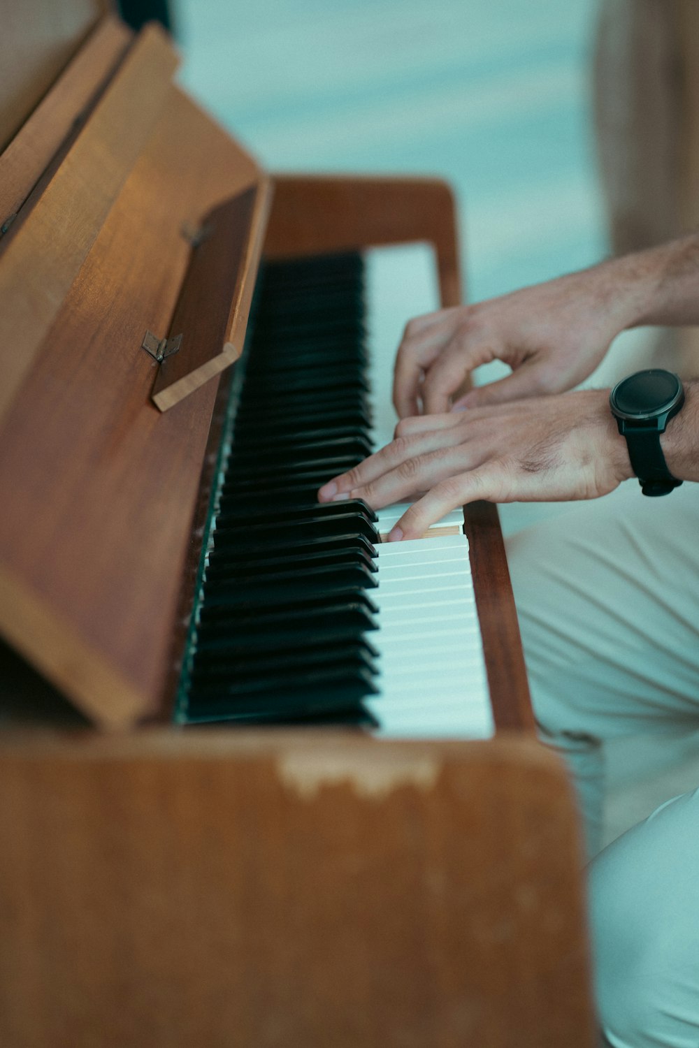 a close up of a person playing a piano