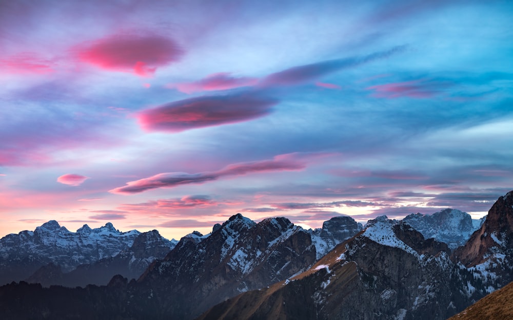 a view of a mountain range at sunset