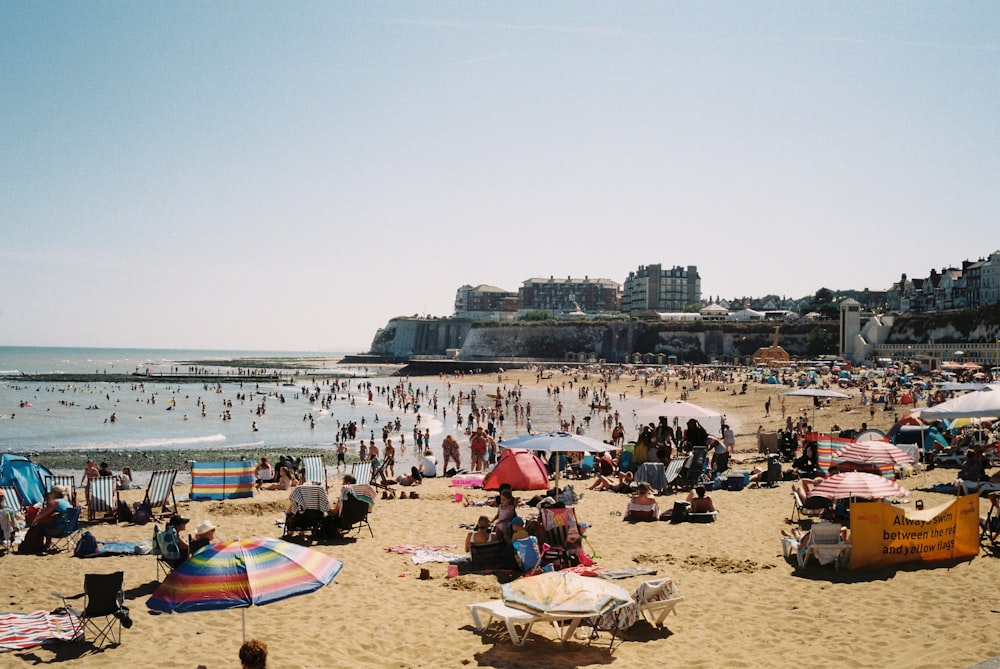 a crowded beach filled with lots of people