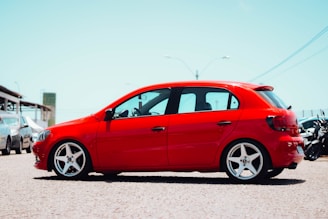 a red car parked in a parking lot