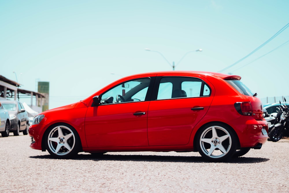 a red car parked in a parking lot