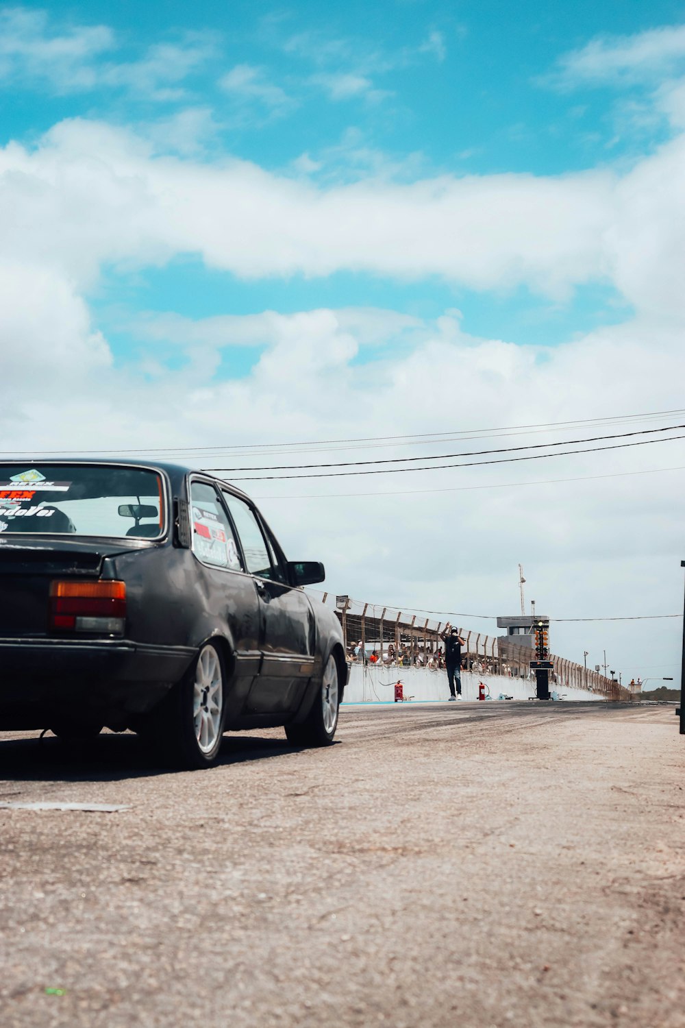 a black car parked on the side of a road