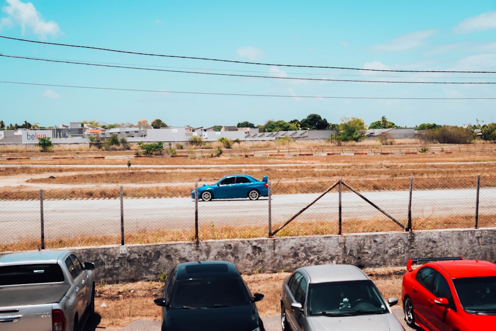 a group of cars parked on the side of a road