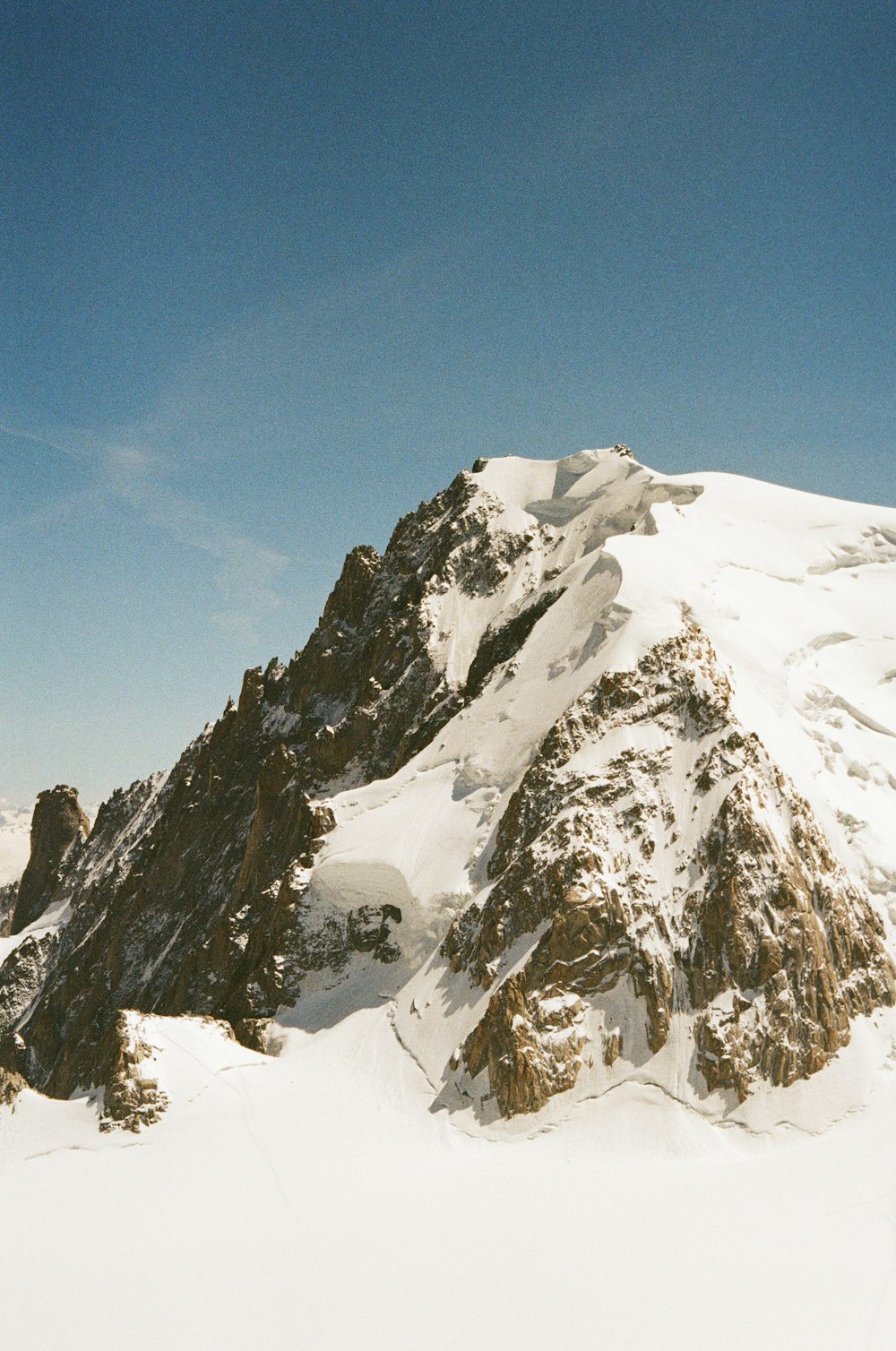 a man riding skis on top of a snow covered slope