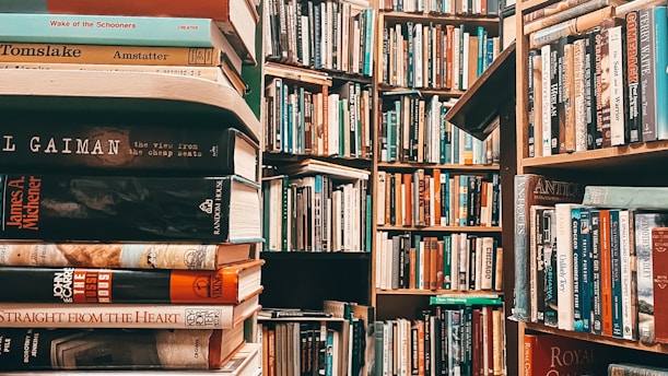 A vibrant image of a school library filled with books and students reading.