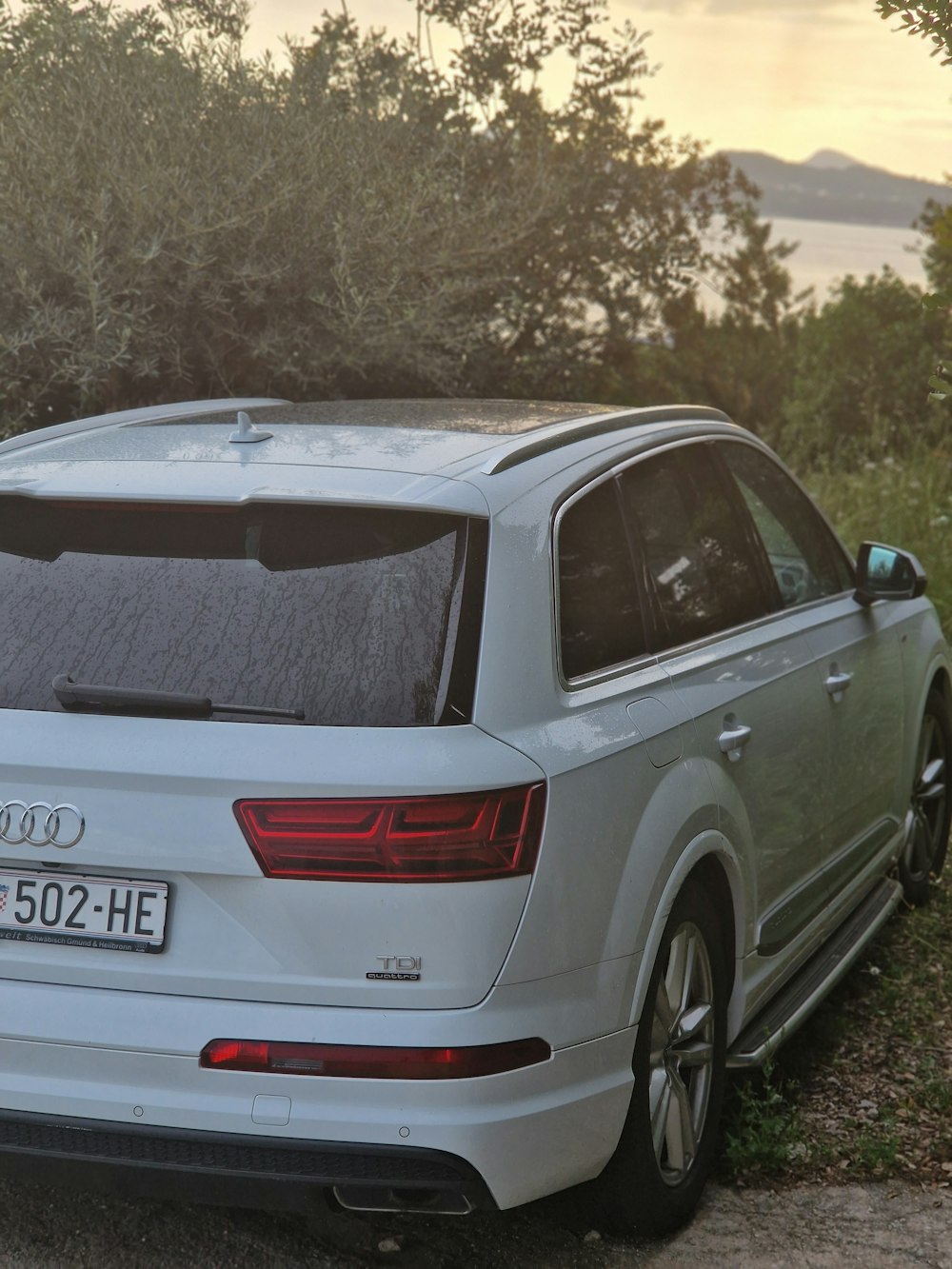 a white car parked on the side of the road