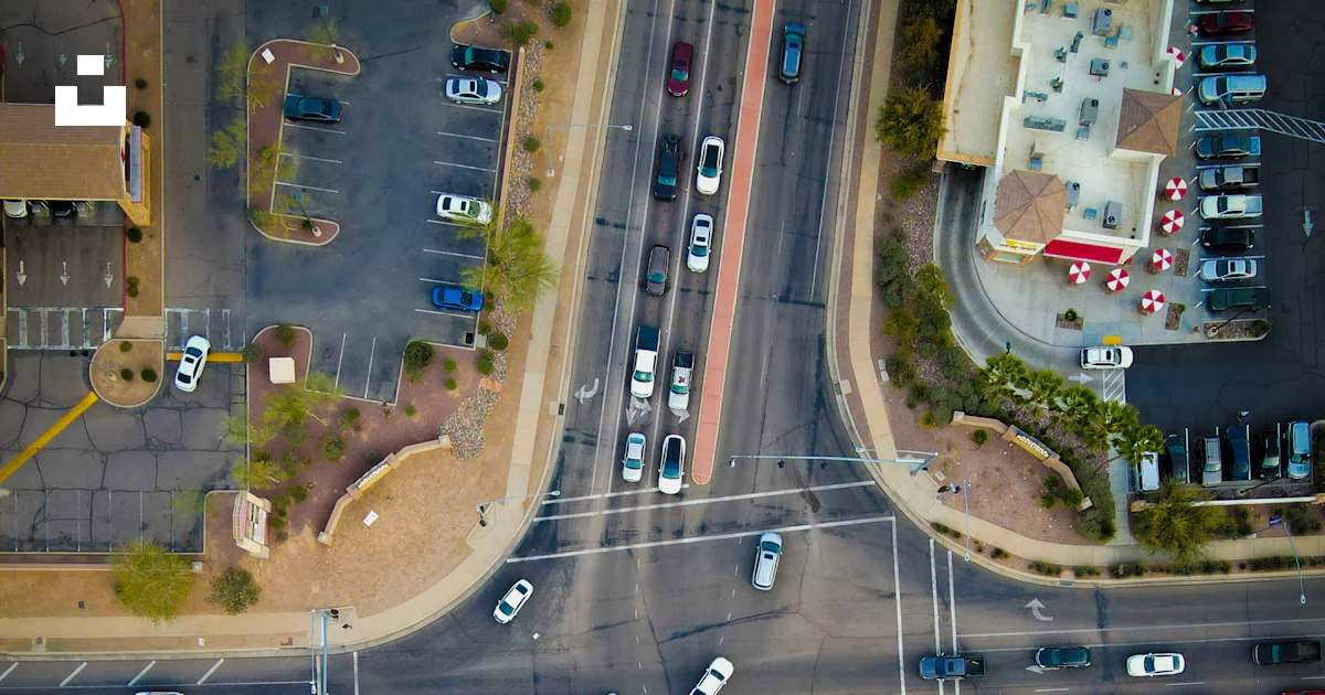 An aerial view of a street intersection with cars photo – Free Car ...