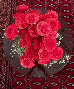 An elegant anniversary floral arrangement with deep red roses.