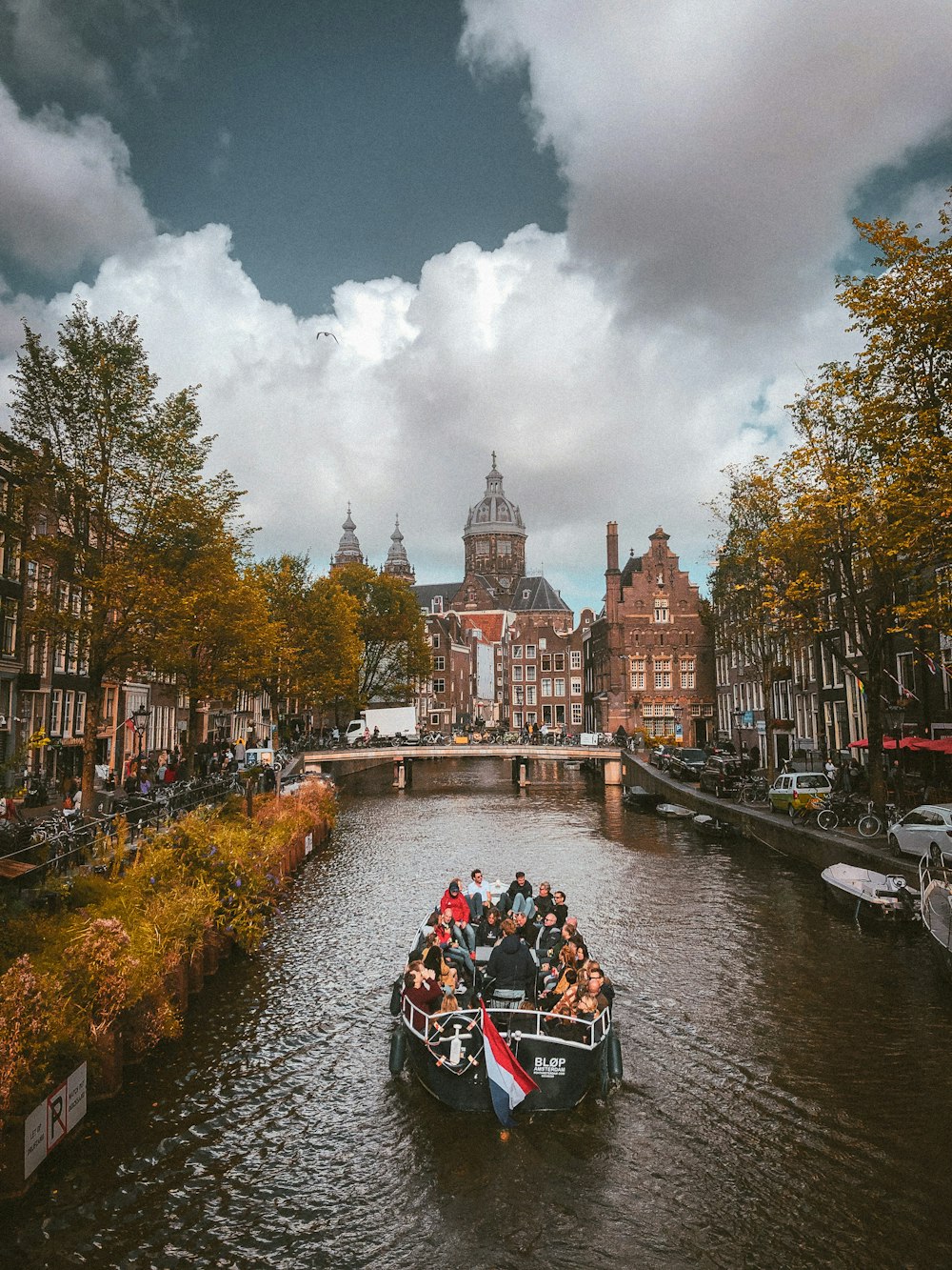 a boat filled with people traveling down a river