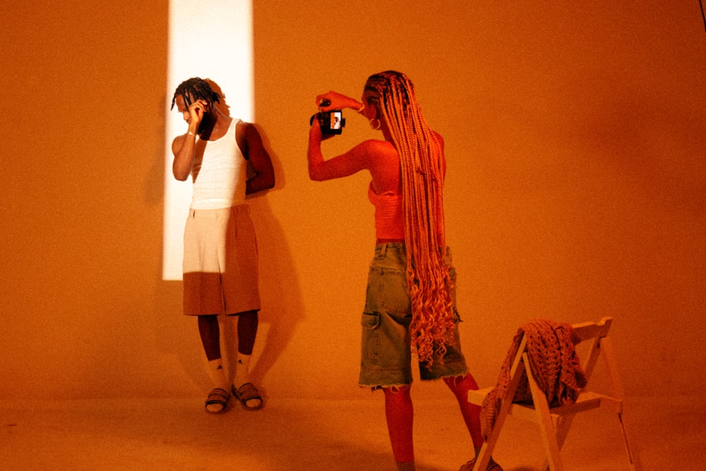 a woman taking a picture of herself in a mirror