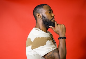 a man with a beard and a white shirt