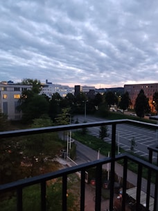 Spacious balcony with city skyline view during blue hour
