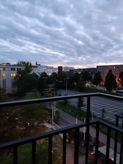 Spacious balcony with city skyline view during blue hour