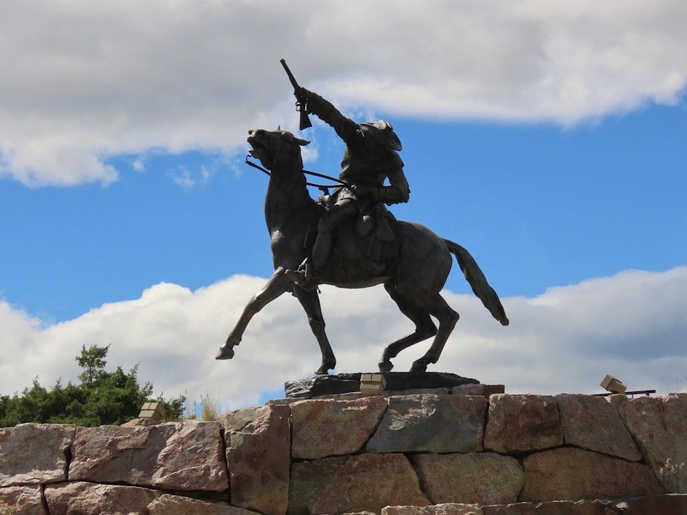 a statue of a man riding on the back of a horse