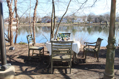 Cozy dining area in the lakeside house with rustic wooden furniture.
