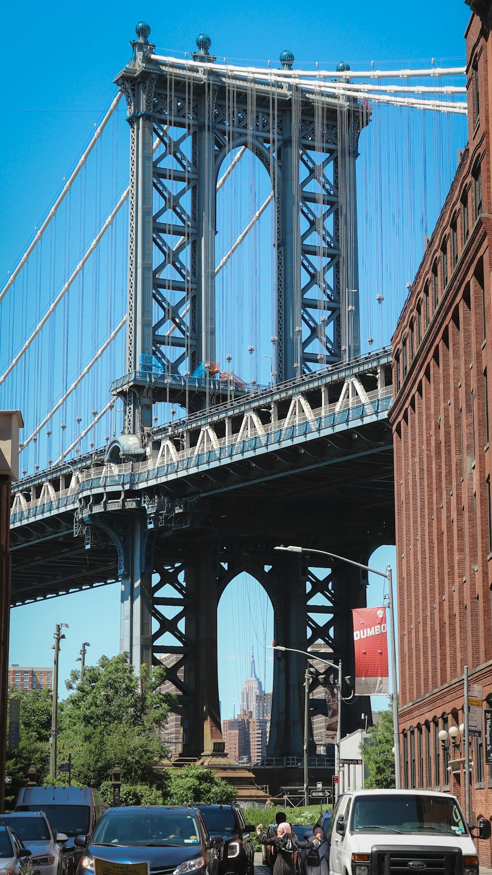 a large bridge spanning over a city street