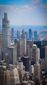 Aerial view of a cityscape showcasing corporate buildings.