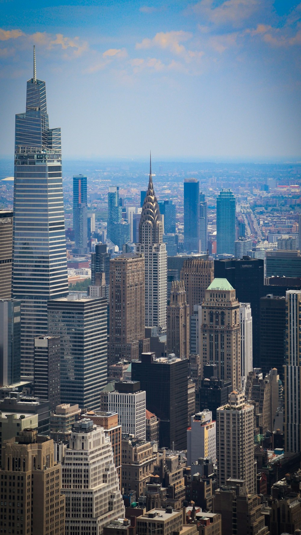 a view of a city with tall buildings