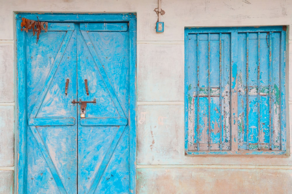 a blue door and window on a building